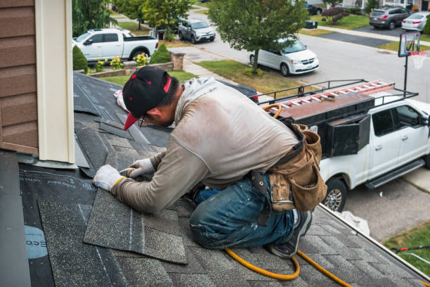 Professional Roofing technician working in Hinton, IA